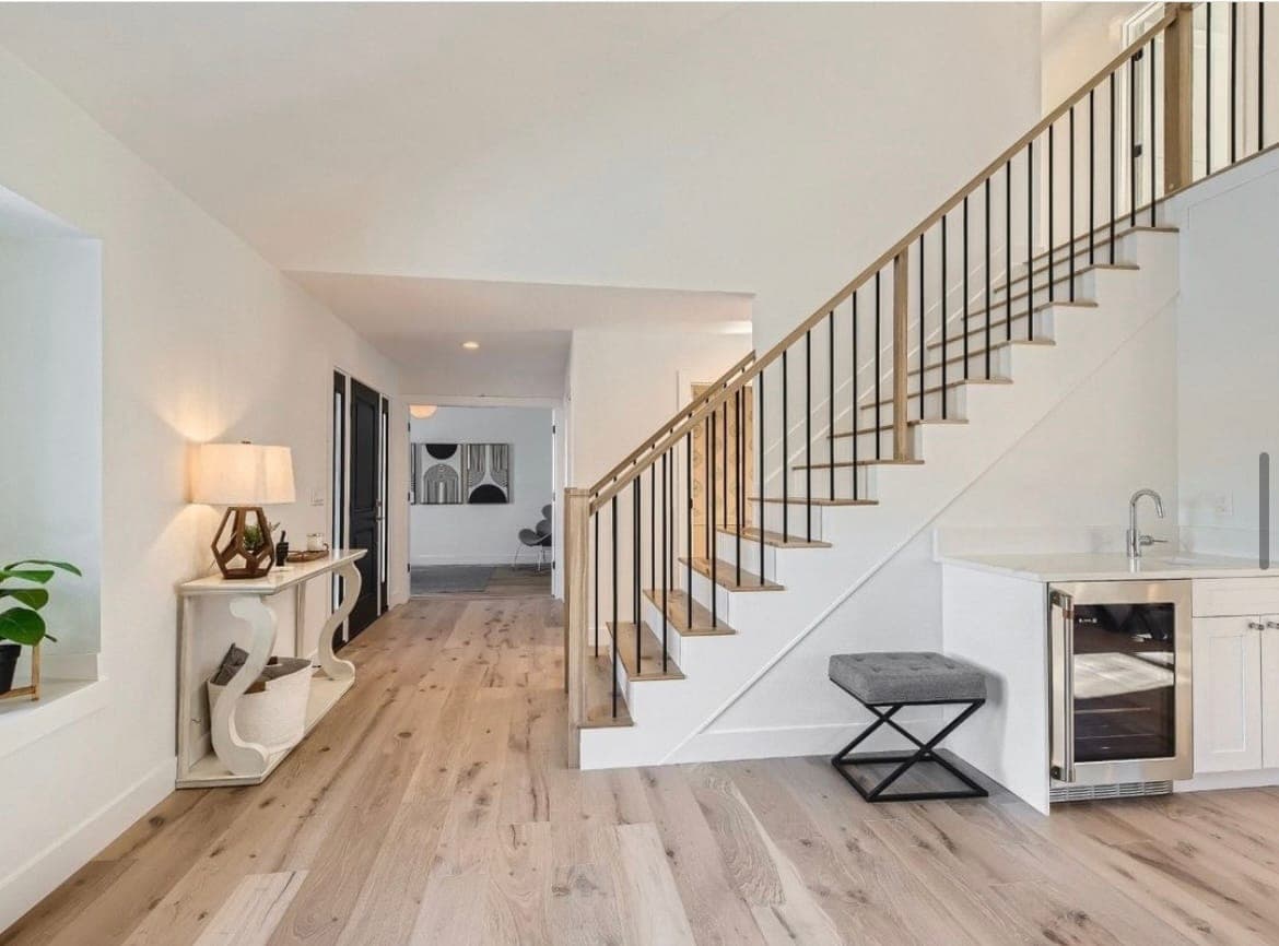 Wide-plank white oak hardwood in a bright entryway